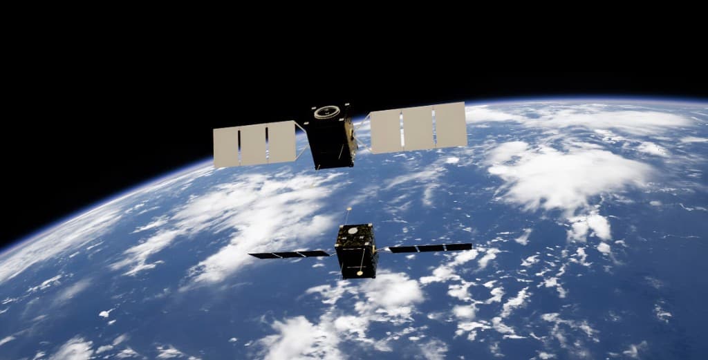 Twin satellites in low Earth orbit above the cloud layer