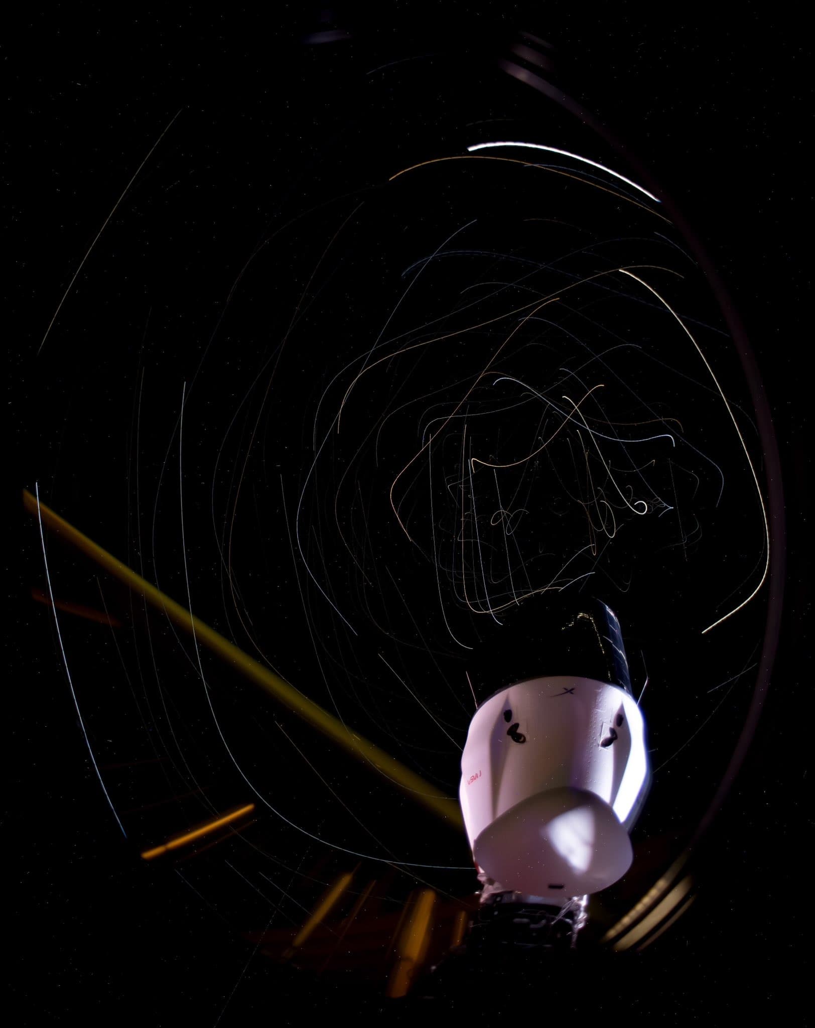 Long-exposure orbital light trails photographed against deep space